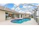 Screened-in pool area with ample seating and a lovely pool at 171 Medalist Rd, Rotonda West, FL 33947