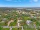 Aerial view showing a single-Gathering house in a quiet residential neighborhood near the water at 1741 Fessler St, Englewood, FL 34223