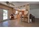 Kitchen with wood cabinets, white appliances, and breakfast bar at 1860 Bluebird Ln, Englewood, FL 34224