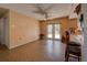 Kitchen with tile floor, breakfast bar, and access to backyard at 1860 Bluebird Ln, Englewood, FL 34224