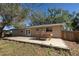 Back patio with tiled flooring and pool table at 1860 Bluebird Ln, Englewood, FL 34224