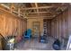 Interior of shed with shelving and gardening tools at 1860 Bluebird Ln, Englewood, FL 34224