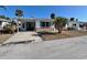 One-story home with teal shutters, a carport, and a brick facade at 1977 Beach Rd # 55, Englewood, FL 34223