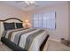 Bedroom with queen bed and window coverings at 23465 Harborview Rd # 203, Punta Gorda, FL 33980