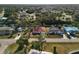 Bird's-eye view of a canal-side neighborhood with tropical trees and houses at 2397 Cannolot Blvd, Port Charlotte, FL 33948