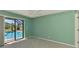 Bedroom with a pool view, a ceiling fan, and access to the lanai at 26098 Constantine Rd, Punta Gorda, FL 33983