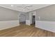 Open-concept dining room with wood-look floors, wainscoting, and easy access to the updated kitchen at 26098 Constantine Rd, Punta Gorda, FL 33983