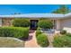 Charming front entrance with well-maintained landscaping, stone accents, and a grand front door at 26098 Constantine Rd, Punta Gorda, FL 33983