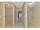 Hallway with tile floors leading to closets and the pool area at 26098 Constantine Rd, Punta Gorda, FL 33983