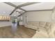 Open-concept living room with kitchen, bar, and view of the screened lanai at 26098 Constantine Rd, Punta Gorda, FL 33983