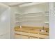 Pantry offers ample storage with built in shelving and cabinets at 26098 Constantine Rd, Punta Gorda, FL 33983