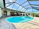 Enclosed pool and spa with lake view at 26098 Constantine Rd, Punta Gorda, FL 33983