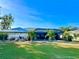 The back of house features an enclosed lanai and well-manicured landscaping, perfect for relaxation at 26098 Constantine Rd, Punta Gorda, FL 33983