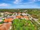 An aerial view of homes in a neighborhood, with trees and landscaping at 28120 Pablo Picasso Dr, Englewood, FL 34223