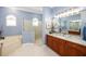 Elegant bathroom with double vanity, large shower, and soaking tub at 3030 Rivershore Ln, Port Charlotte, FL 33953