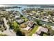 Stunning aerial view of waterfront home with a private dock and lush foliage at 385 Pelican Bnd, Placida, FL 33946