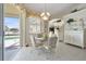 Bright breakfast area with sliding glass door that leads out to the pool at 385 Pelican Bnd, Placida, FL 33946