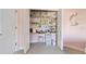 Closet converted into a small office space with a desk and storage at 385 Pelican Bnd, Placida, FL 33946