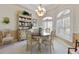Dining room with decorative hutch and large windows with plantation shutters at 385 Pelican Bnd, Placida, FL 33946