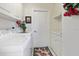 Laundry room with white cabinets, washer, and dryer at 385 Pelican Bnd, Placida, FL 33946