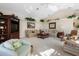 Spacious living room with high ceilings, built-in shelves, and ample natural light at 385 Pelican Bnd, Placida, FL 33946