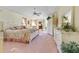 Large main bedroom with pink carpet, white furniture, and floral patterns at 385 Pelican Bnd, Placida, FL 33946