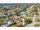 Beautiful canal-front community with luxurious homes, lush lawns, and mature trees at 385 Pelican Bnd, Placida, FL 33946