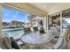 Spacious screened patio with a pool view and outdoor dining area at 385 Pelican Bnd, Placida, FL 33946