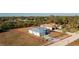 Aerial view showing a light teal house and large lot at 409 Boundary Blvd, Rotonda West, FL 33947