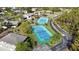 Aerial view of community with tennis courts and residential buildings at 4260 Placida Rd # 14C, Englewood, FL 34224