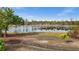 Peaceful backyard with pond and lush foliage at 4260 Placida Rd # 14C, Englewood, FL 34224