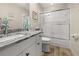Updated bathroom with granite countertop and tiled shower at 4260 Placida Rd # 14C, Englewood, FL 34224