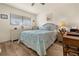 Guest bedroom with full-size bed and wood desk at 4260 Placida Rd # 14C, Englewood, FL 34224