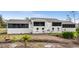 Back exterior view of condo with screened balcony at 4260 Placida Rd # 14C, Englewood, FL 34224