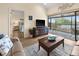 Living room with access to a screened balcony overlooking a canal at 4260 Placida Rd # 14C, Englewood, FL 34224