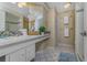 Bathroom with double vanity and a large walk-in shower at 4656 Pompano St, Placida, FL 33946