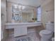 Clean bathroom with double vanity and large mirror at 4656 Pompano St, Placida, FL 33946