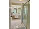 Bathroom with shower, double vanity, and tile floors at 4656 Pompano St, Placida, FL 33946