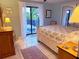Bedroom with pool view and sliding glass doors at 4656 Pompano St, Placida, FL 33946