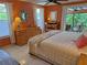 Bedroom with a dresser, desk, and sliding glass doors at 4656 Pompano St, Placida, FL 33946
