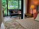 Bedroom with access to a relaxing screened porch at 4656 Pompano St, Placida, FL 33946