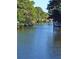 Peaceful canal scene with waterfront properties and lush vegetation at 4656 Pompano St, Placida, FL 33946