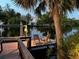 Tranquil waterfront dock with seating, perfect for enjoying sunset views at 4656 Pompano St, Placida, FL 33946