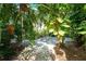 Lush, shaded pathway winds through tropical foliage at 4656 Pompano St, Placida, FL 33946