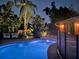 Inviting swimming pool area, illuminated at night at 4656 Pompano St, Placida, FL 33946