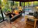 Screened porch with wicker furniture and pool view at 4656 Pompano St, Placida, FL 33946