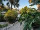 Scenic waterfront pathway with lush landscaping and canal views at 4656 Pompano St, Placida, FL 33946