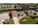 An aerial view of a single-story home with waterfront access and a private pool at 47 Sportsman Ln, Rotonda West, FL 33947