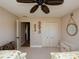 Bedroom with two twin beds, ceiling fan, and closet with double doors at 47 Sportsman Ln, Rotonda West, FL 33947