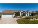 One-story home with landscaped front yard and attached garage at 47 Sportsman Ln, Rotonda West, FL 33947